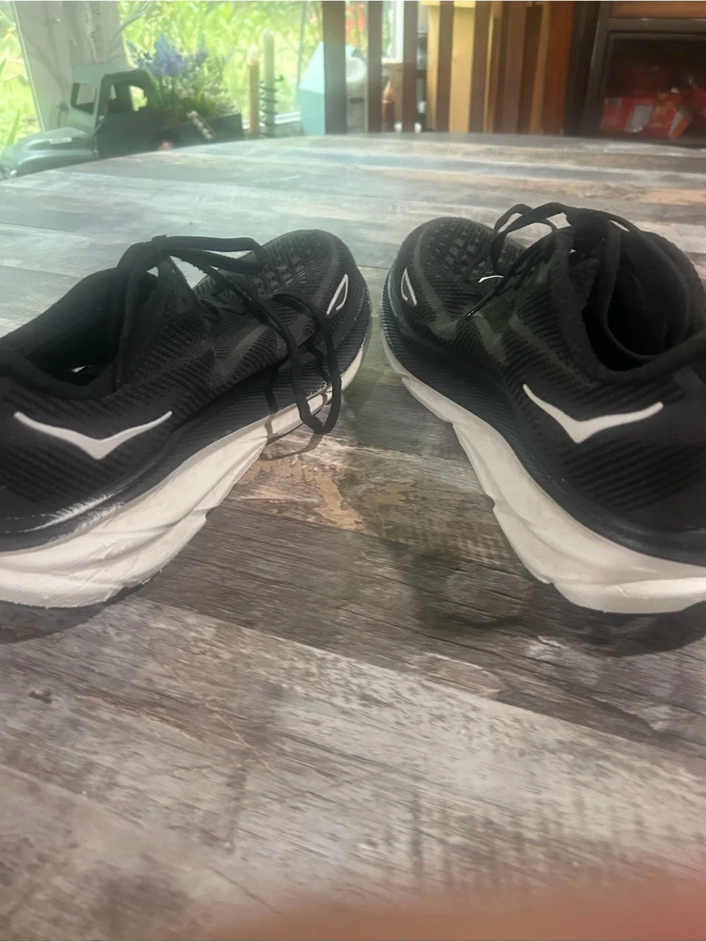 Men's size 11.5D Hoka Black and White Road Running Shoes